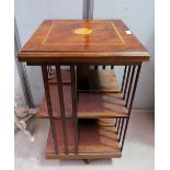 An Edwardian style revolving bookcase, inlaid mahogany in the Sheraton style