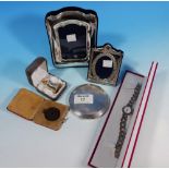 A marcasite dress watch; 2 silver photo frames; an engine turned silver compact, Birmingham 1940;