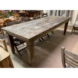 A large stripped wood dining table on square tapering legs, length 98", width 39"