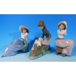 Three Nao figures of girls seated with pets, height 6"