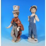 A Lladro figure of an Eton Schoolboy, 8.5" and another of a girl in dungarees