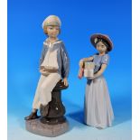 A Lladro figure of a girl in sailor's costume, 9" and another of a birthday girl