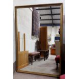 A large gilt framed wall mirror, 64" x 44"