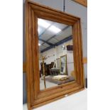 A large wall mirror in rectangular stained wood frame, 48" x 36"