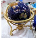 A gilt and stone effect table globe