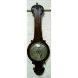 A 19th century large mercury column barometer in mahogany banjo shaped case, with carved