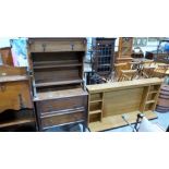 An oak students bureau, a small oak chest of drawers (worm) and a fire surround