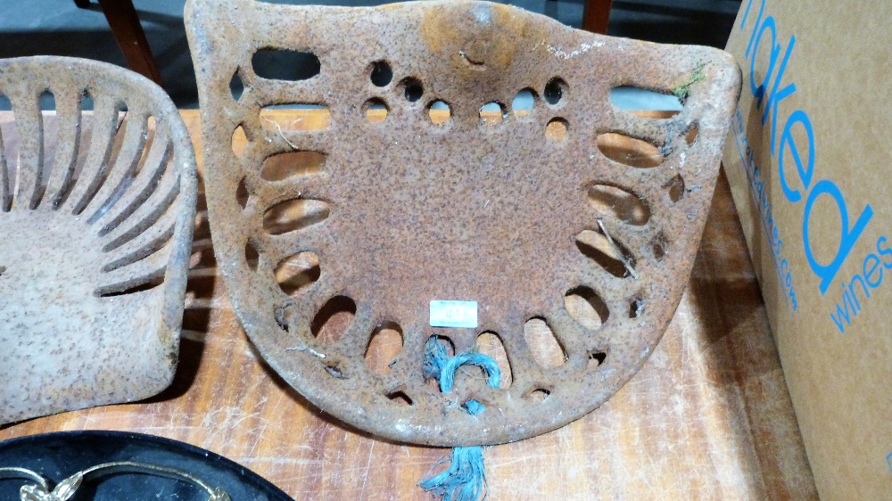 A cast iron tractor seat