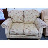 A good quality sofa upholstered in cream floral fabric. 55'' wide