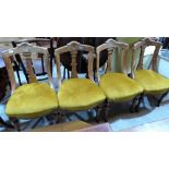 A set of four late Victorian oak 'aesthetic' dining chairs