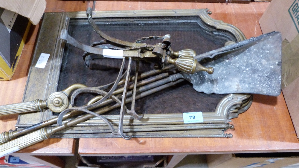 A four fold brass fire guard, brass fire irons and a pair of andirons
