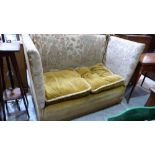A 1920's knole sofa requiring reupholstering. 58'' wide