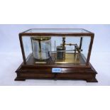 A cased Negretti and Zambra gilt brass barograph with chart drawer. 14½'' wide