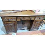 An Old Charm linen fold carved oak dressing table