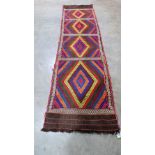 A Suzni kilim runner. 2.75m x 0.71m