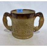 A Victorian salt glazed stoneware mug with two hound handles and sprigged decoration of St George