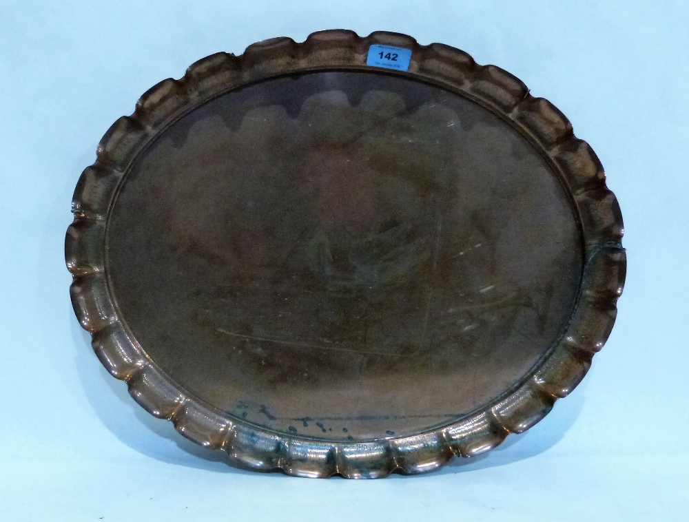 An Arts and Crafts copper oval tray with crimped rim. 20'' wide