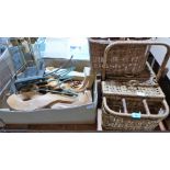 Two wicker baskets, a box of wood carvings and a magazine rack