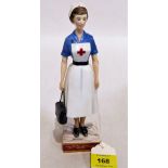 A Royal Worcester figure, British Red Cross Society V.A.D Member. Modelled by Ruth Van Ruyckevelt.