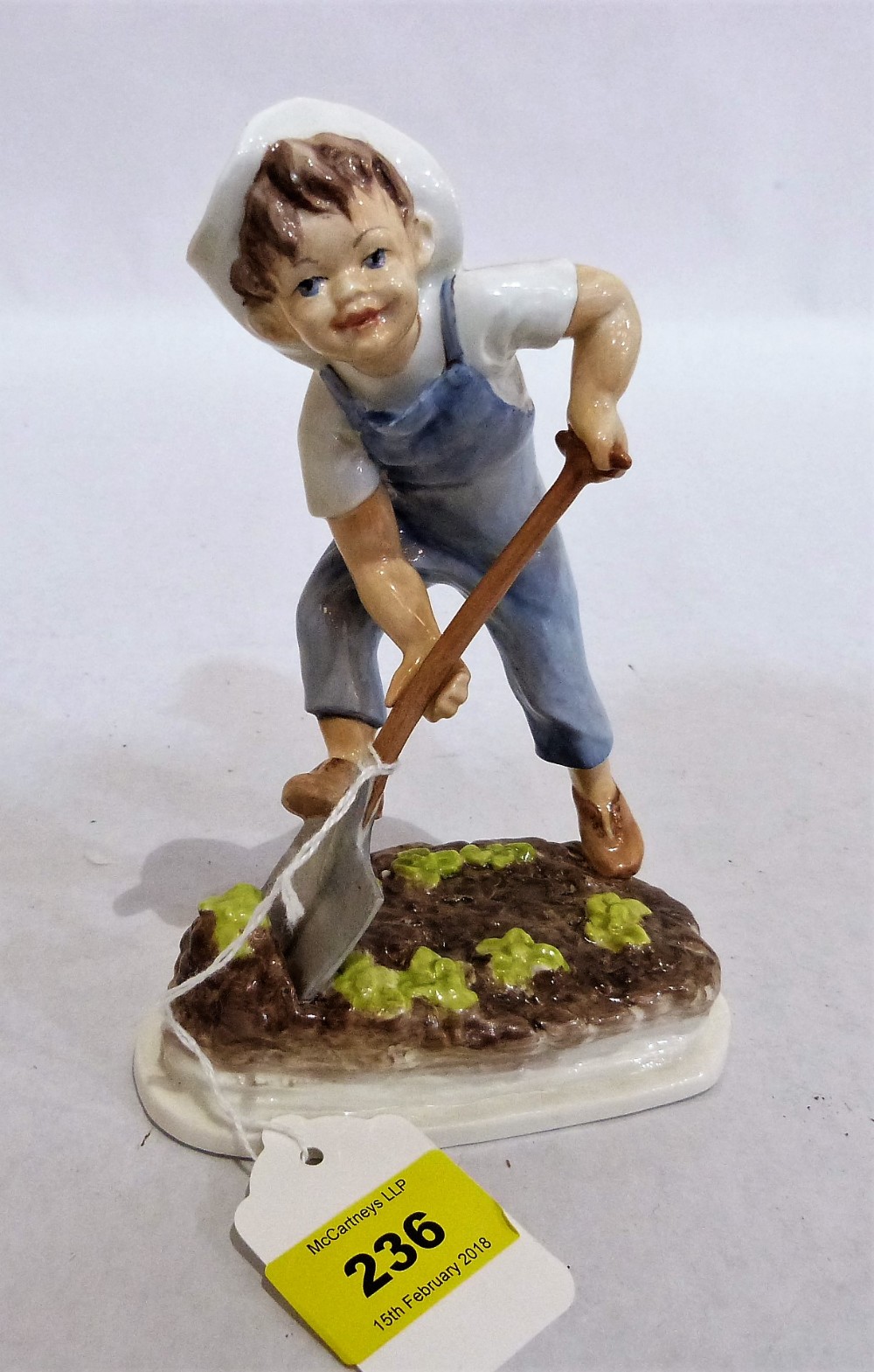 A Royal Worcester figure, Saturday's Child Works Hard for a Living 3524. 7'' high