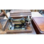 A singer sewing machine in case