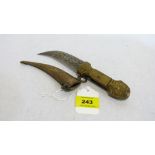 An Indian brass dagger with engraved decoration and horn applied handle. 9'' long