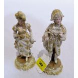 A pair of continental bisque figures, a gallant and female companion, painted and gilded. 6½'' high
