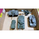 A Dinky Toys tank and truck and three other military vehicles. Play worn