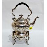 A plated kettle with foliate engraved decoration on a spirit burner stand. 13'' high