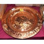 An Arts and Crafts style copper charger. 17'' diameter