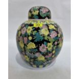 A Chinese jar and cover, painted in shades of famille-rose, yellow and green with chrysanthemums