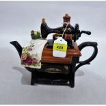 A Royal Albert Old Country Roses novelty teapot in the form of a sewing machine. 9'' high