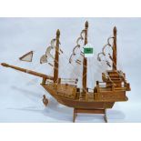 A treen model of a galleon on a stand. 17'' high