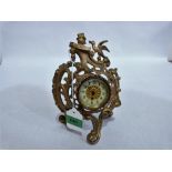 A French rococo revival gilt speltar mantle clock with drum movement (running). 8½'' high