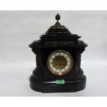 A French black slate mantle clock, the architectural case decorated with bands of figures after