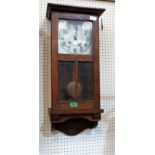 A 1930's oak cased wall clock with two train movement. Not running. 28'' high