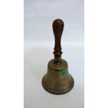 A bronze hand bell with turned treen handle. 11'' high