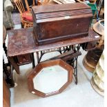 A trestle iron based sewing machine, an oak octagonal mirror, an open bookcase and an oak