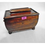 An early Victorian mahogany sarcophagus tea caddy, the pagoda lid revealing a pair of caddies and