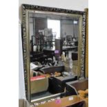 A gilt framed mirror. 33½'' high