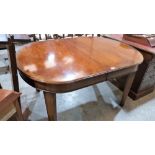 A Victorian style mahogany dining table extending to 96'' with two extra leaves
