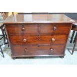 A Victorian mahogany chest with two short over two long drawers on bun feet. 48'' wide