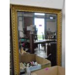 A gilt framed mirror with bevelled plate. 35'' high