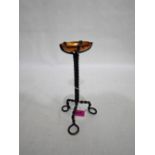 An Arts and Crafts style wrought iron and copper pricket stick with twisted stem. 9½'' high