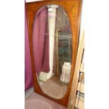 A 19th century inlaid satinwood mirror with oval bevelled plate. 52'' high