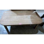 An oak low table on square legs. 40'' wide