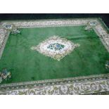 A green ground oriental carpet. 160'' x 116''