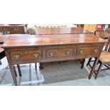 An 18th century style oak low dresser with three drawers on square legs. 60'' wide