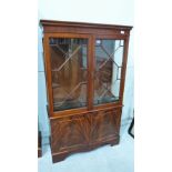 A mahogany astragal glazed display cabinet of recent manufacture. 36'' wide