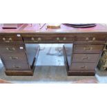 An oak pedestal desk with leather inlet top. 60'' wide